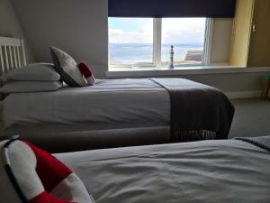Cama ou camas em um quarto em The Shore