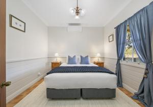 En eller flere senge i et værelse på Scarborough Cottage