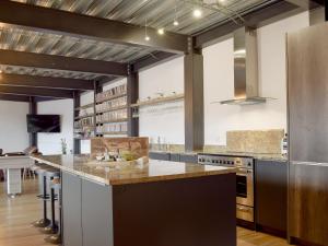 a large kitchen with a large island in a room at Chapelburn in Lawers