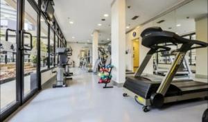 a gym with tread machines and a treadmill at Esuites Congonhas in Sao Paulo