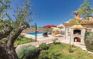 a villa with a swimming pool and a house at Family friendly house with a swimming pool Gajana, Fazana - 15385 in Mednjan