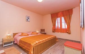 a bedroom with a bed and a window at Family friendly house with a swimming pool Gajana, Fazana - 15385 in Mednjan +17 photos
