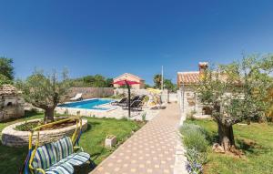 a garden with a swimming pool and a house at Family friendly house with a swimming pool Gajana, Fazana - 15385 in Mednjan