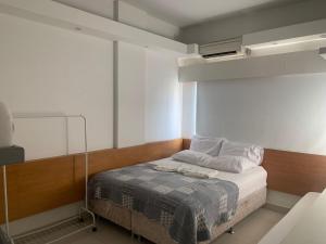 a bedroom with a bed with a blanket on it at Real Apartments 255 - High level Copacabana 2 bedrooms close to Ipanema in Rio de Janeiro