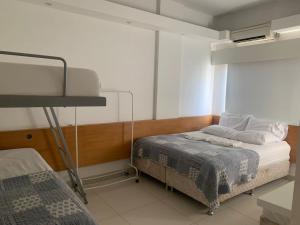 a bedroom with a bed and a lamp in it at Real Apartments 255 - High level Copacabana 2 bedrooms close to Ipanema in Rio de Janeiro