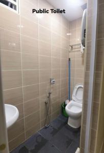 a bathroom with a toilet and a sink at Big House In Alor Setar Taman Sri Ampang in Alor Setar +12 photos