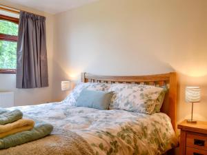 a bedroom with a bed and a window at Bryn Villa in Newbridge on Wye