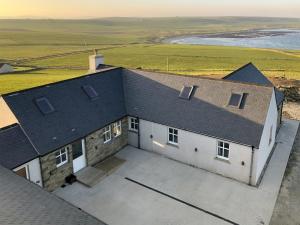 an aerial view of a house with a roof at Egypt in Newbigging