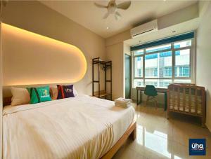 a bedroom with a large bed and a window at Midori Green By JK Home in Johor Bahru
