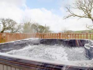 a plunge pool with water in a fence at Brynhowell in Llanglydwen