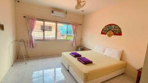 Postel nebo postele na pokoji v ubytování Lotus Hostel Beach Koh Tao + 37 fotografií
