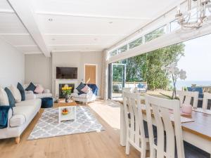 a living room with a couch and a table at Beach Retreat in Corton
