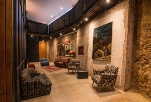 a lobby with chairs and a couch in a room at Fauna Hotel in Valparaíso