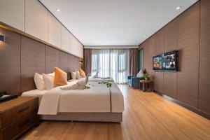 Sjónvarps- og/eða afþreyingartæki á Huanyu Jun Hui Hotel