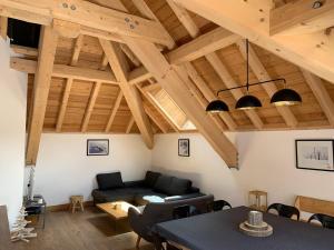 a living room with a couch and a table at Chalet Valloire, 5 pièces, 8 personnes - FR-1-263-524 in Valloire