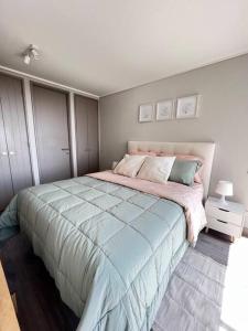 a bedroom with a large bed in a room at Apartamento General Mackenna B&E in Santiago