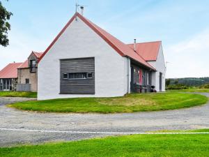 a white house with a red roof at The Barn - Uk33396 in Isle of Gigha