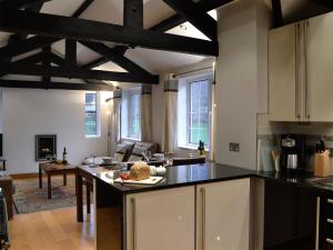 a kitchen with a kitchen island in a room at Castle Howe in Rosthwaite