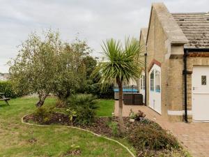 a house with a garden in front of it at The Boathouse in East Cowes