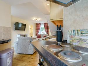 a kitchen with a counter with dishes on it at Margaret House in Chirnside