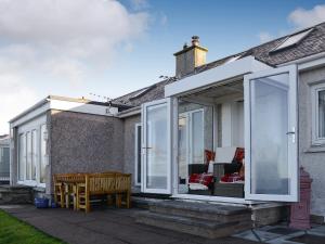 an extension of a house with sliding glass doors at Ruach in Gardenstown
