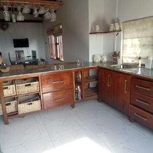 a kitchen with a sink and a counter top at Bird Nest - Hanthana in Kandy
