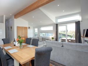 a living room with a table and a couch at Moornook 7-uk36703 in Newton Abbot