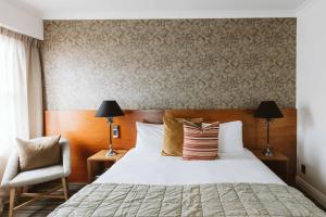Posteľ alebo postele v izbe v ubytovaní The State Hotel