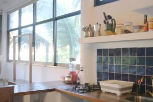 a kitchen with a counter with a blender on it at Casa shanti penthouse with AC in Puerto Escondido