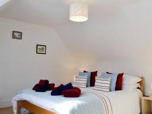 a bedroom with two beds with pillows on them at Craigclunie in Ballater