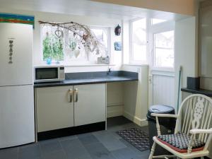 a kitchen with a sink and a microwave at Wild Duck in Pennington