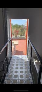 an open door to a balcony with a view at Cancún Hotel Boutique & Hostel in Cancún