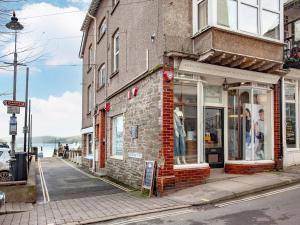 a brick building on the side of a street at The Lookout in Salcombe