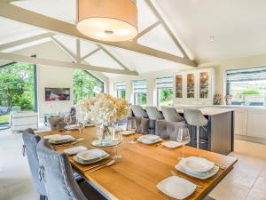 a dining room with a wooden table and chairs at Uk34190 - Gowan View in Arkholme