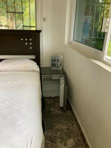 A bed or beds in a room at Casa Breizh