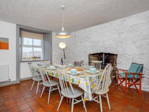 a dining room with a table and chairs at Seafield House in Lochinver