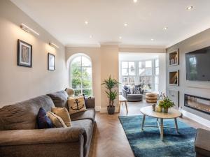 a living room with a couch and a table at Martineau House in Tynemouth