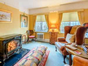 a living room with a fireplace and a couch at Brandon in Sutton on Sea