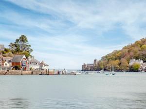 a view of a body of water with houses and boats at Dartview in Dartmouth