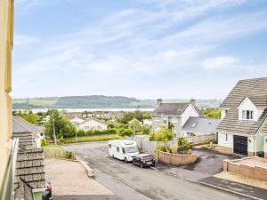 an aerial view of a residential neighbourhood with a white van parked in a driveway at Trondra House in Ferryside