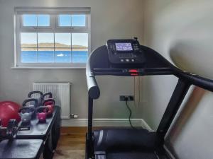a treadmill in a room with a window at Point Park in Taynuilt