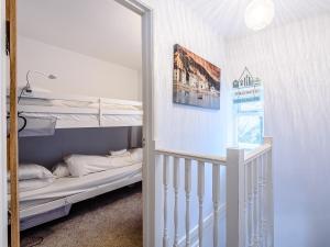 a small room with a bunk bed and a staircase at Sunny Shores - Uk32245 in Aberdyfi