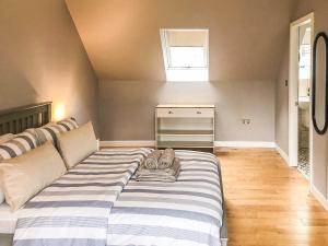 a large bed in a room with a couch at Fernbrae in Fort William