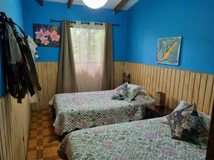 Postel nebo postele na pokoji v ubytování Hostal Vieroto