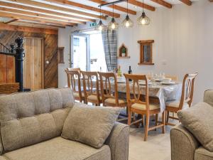a kitchen and dining room with a table and chairs at The Old Stables in Tickton