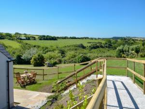 a view of a garden from the balcony of a house at The Retreat - Uk33306 in Hayscastle