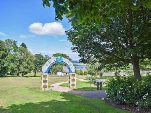 a arch in a park with a pathway at Newburgh C Listed Townhouse in Newburgh