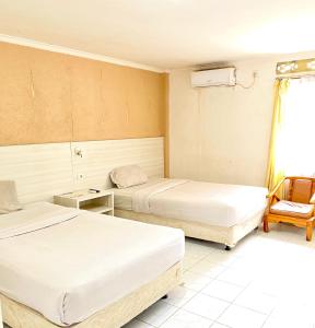 Postel nebo postele na pokoji v ubytování HEMRA HOTEL + 6 fotografií