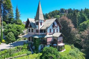 an aerial view of a house with a turret at Relais Villino Rubini in Brunate