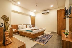 Postel nebo postele na pokoji v ubytování Hotel Naman